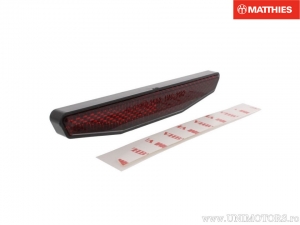 Reflector (cat's eye) trapezoid 125x18x9mm red color fixed with adhesive tape - JM